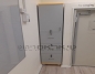 ארון מותאם לנישה וכולל נעילה, בחלק העליון מדפים ובחלק התחתון שלוש מגירות